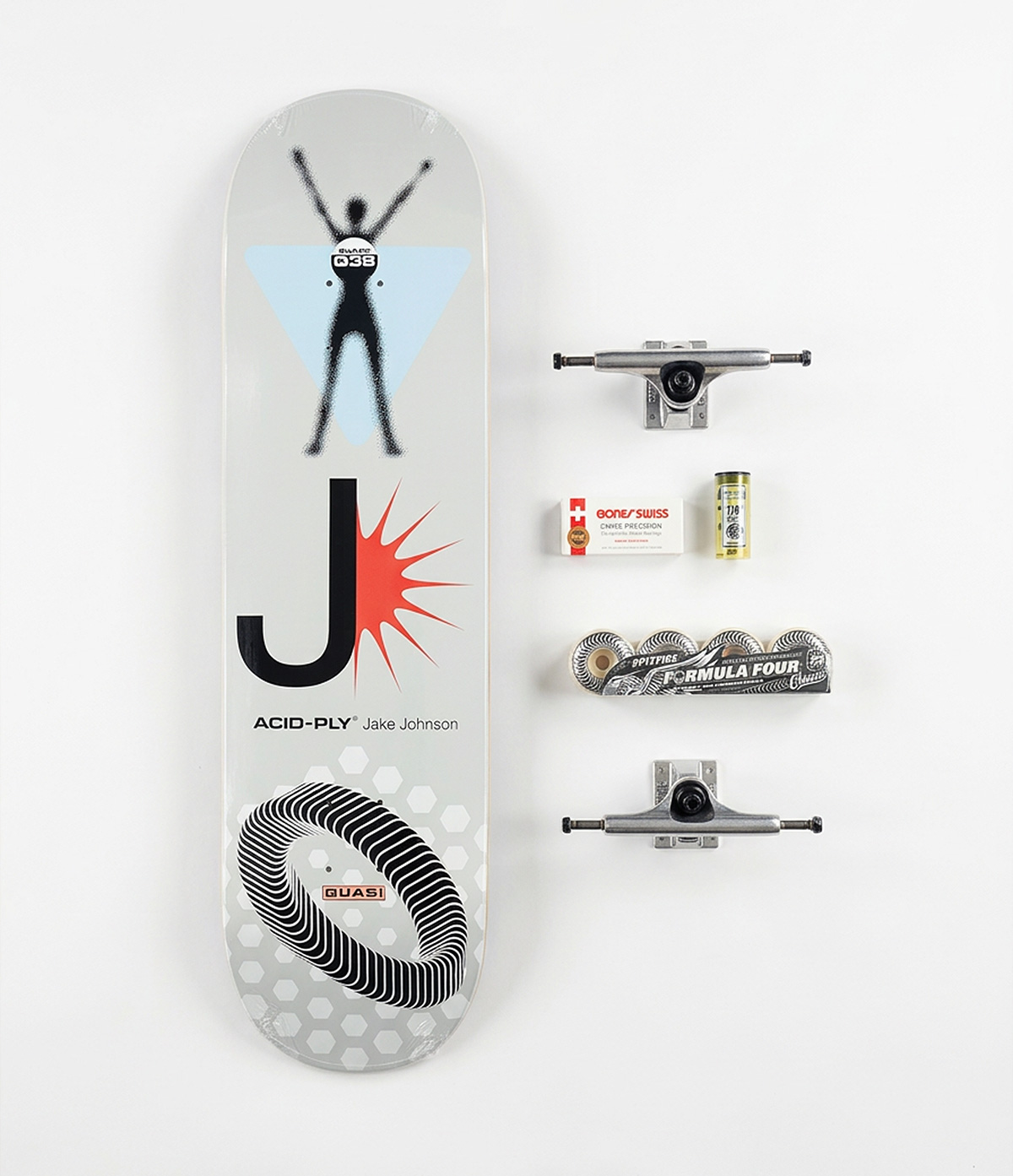 A skateboard deck, trucks, wheels, bearings and hardware laid out together